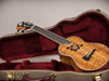 A master grade concert ukulele in an Ameritage case with hibiscus sound hole