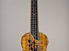 This concert ukulele has abalone purfling and mastergrade curly koa.