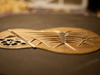 A tenor ukulele top with Kash bracing and hibiscus soundhole.