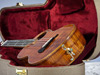 Part of the full nouveau theme, a simple vine inlay on the tailblock.