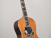 Vintage parlor guitar with a redwood top.