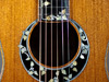 White and gold mother of pearl inlay.